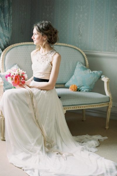 image of bridal portrait pose indoors seated with bouquet